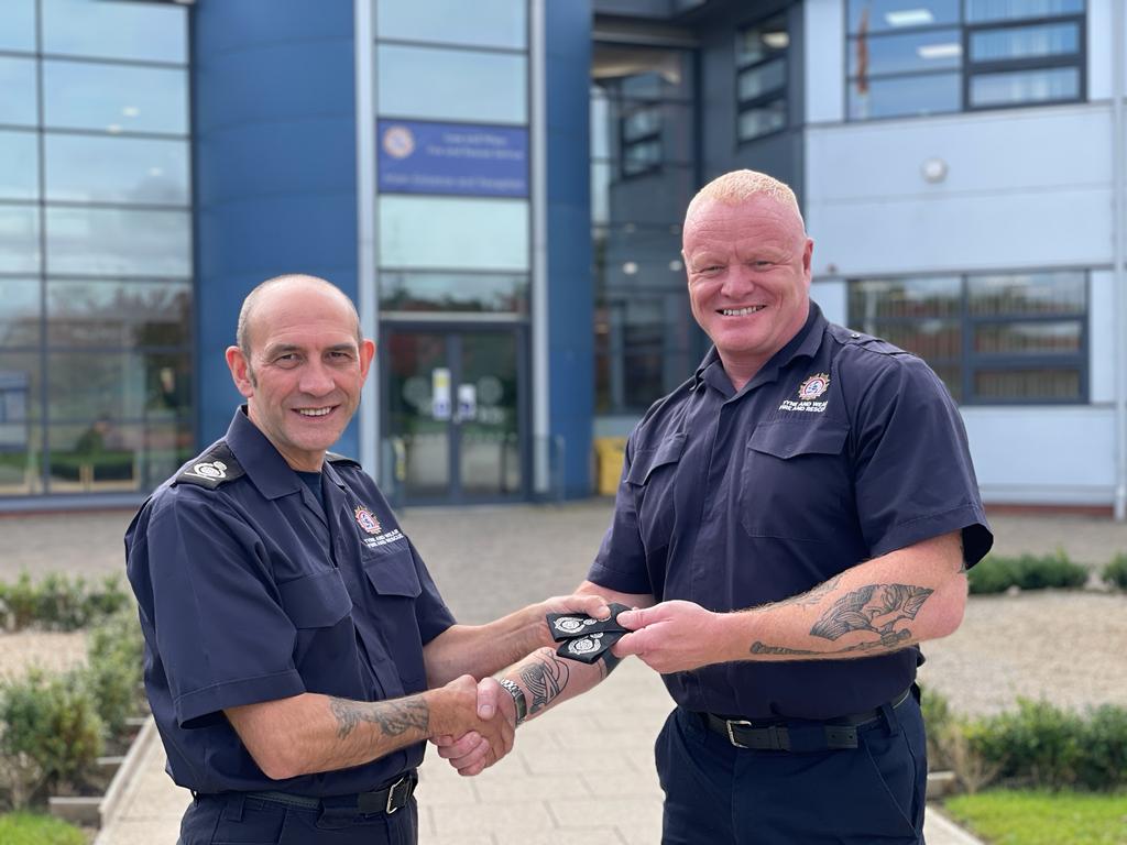 Chief Fire Officer Lowther with Chief Fire Officer Heath Passing of epaulettes