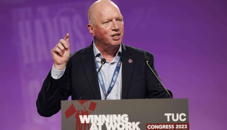 Matt Wrack stands at TUC Podium mid speech