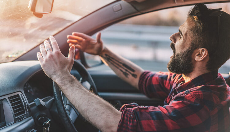 Young man getting angry on the road
