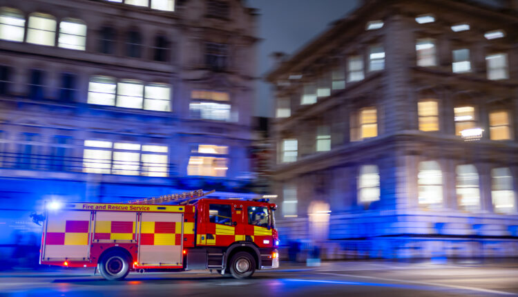 Fast red firetruck on emergency call in London