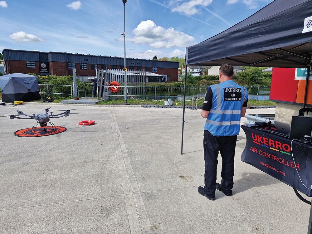 man operating drone